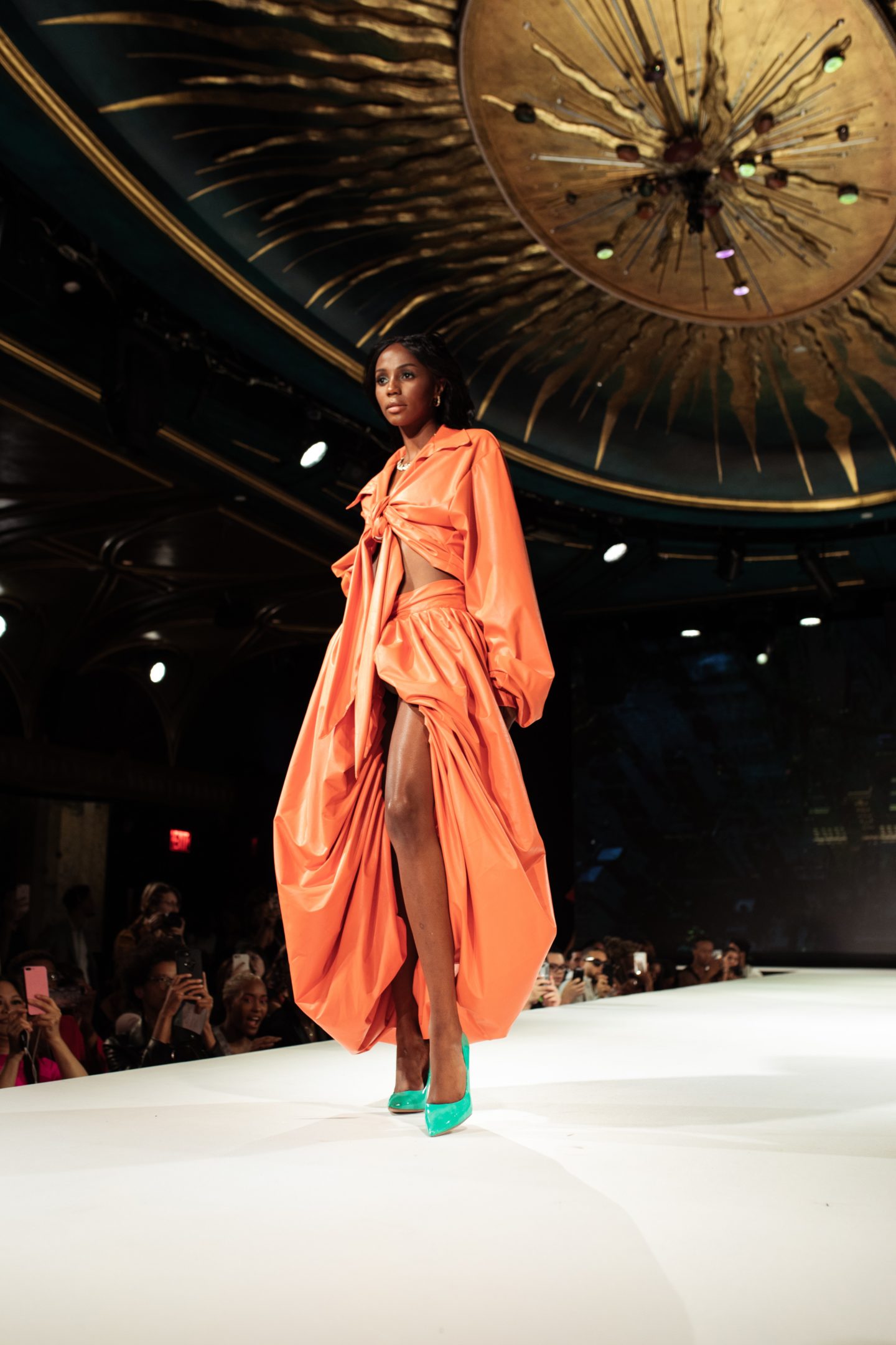 model in orange puff dress