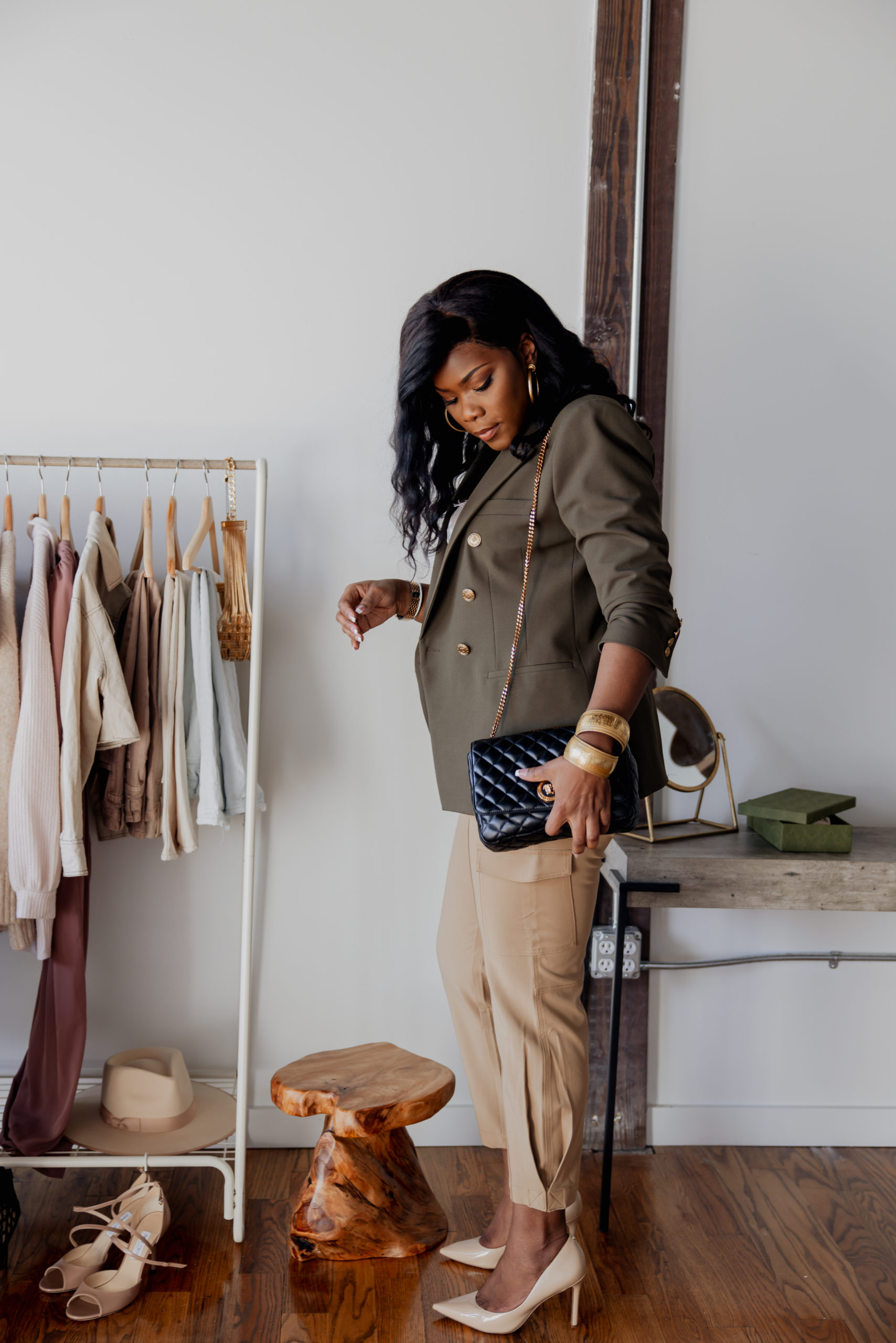 Green blazer with gold buttion withs a tans pair of cargo pants