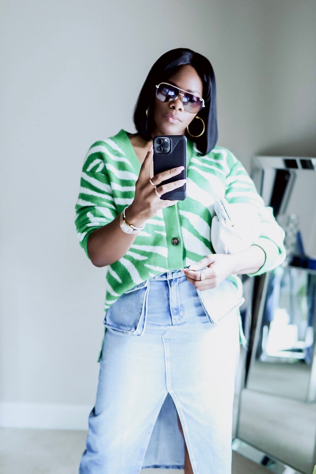 green and white zebra cardigan with a denim blue skirt